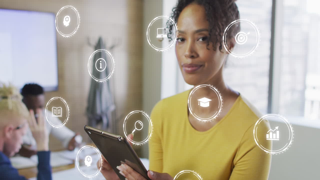 Animation of icons and data processing over biracial businesswoman in office