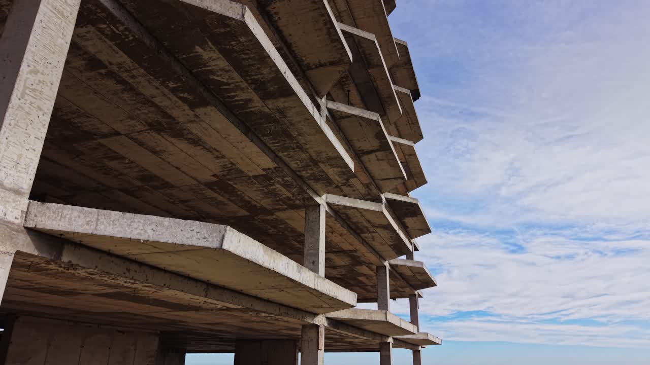 Abandoned coastal building with ocean view under clear blue sky