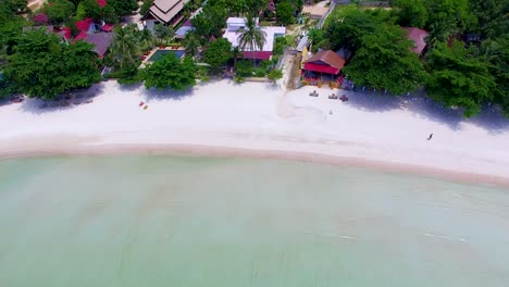 Panning-from-right-to-the-the-left-side-of-the-frame-of-an-overhead-drone-shot-of-Thong-Nai-Pan-Yai-Island-beach-front,-at-Koh-Pangan-in-the-the-South-of-Thailand