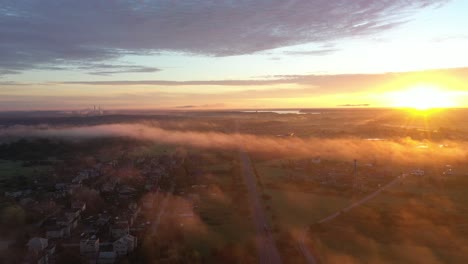 Drone-aerial-view-of-road-during-foggy-morning