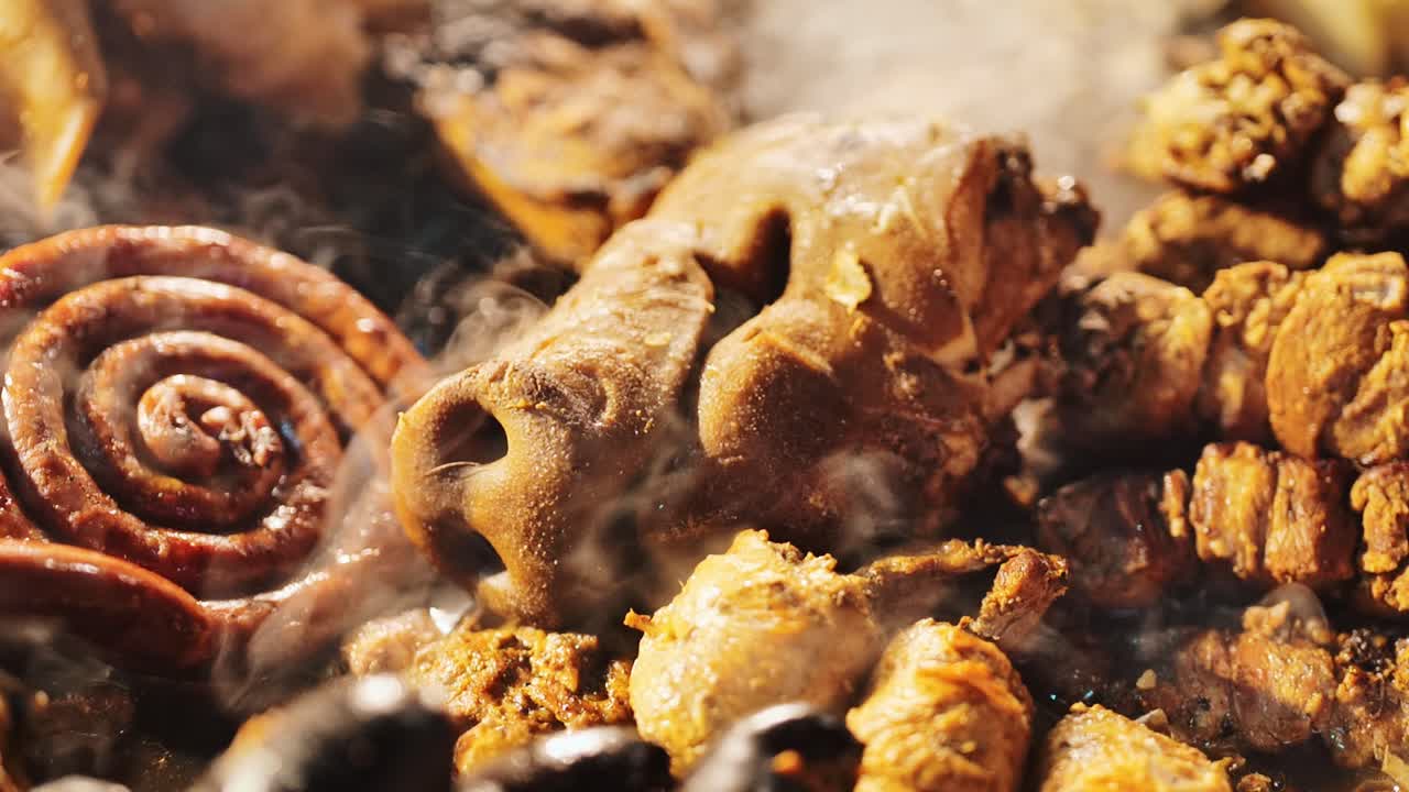 Slow-motion shot of a pig snout surrounded by freshly Latvian roasted meats, 4K