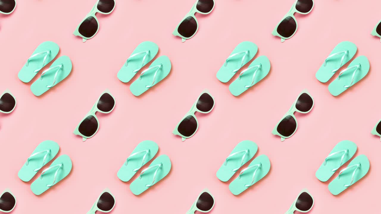 Green flip flops and eyeglasses over pink. 4k video