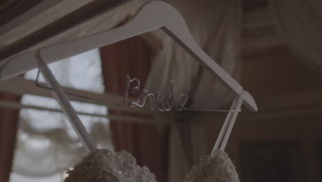 cinematic slow motion shot of wedding dress hanging in customized bride hanger. shot in 4k 60fps for high quality slow motion. purchase entire event raw at wholesale price email willneatheryyahoo.com