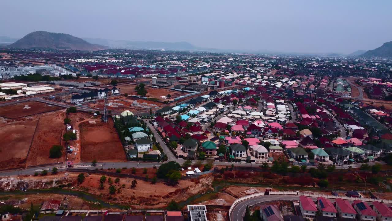 Vibrant rooftops and scenic layout define this suburban district, Abuja, Nigeria