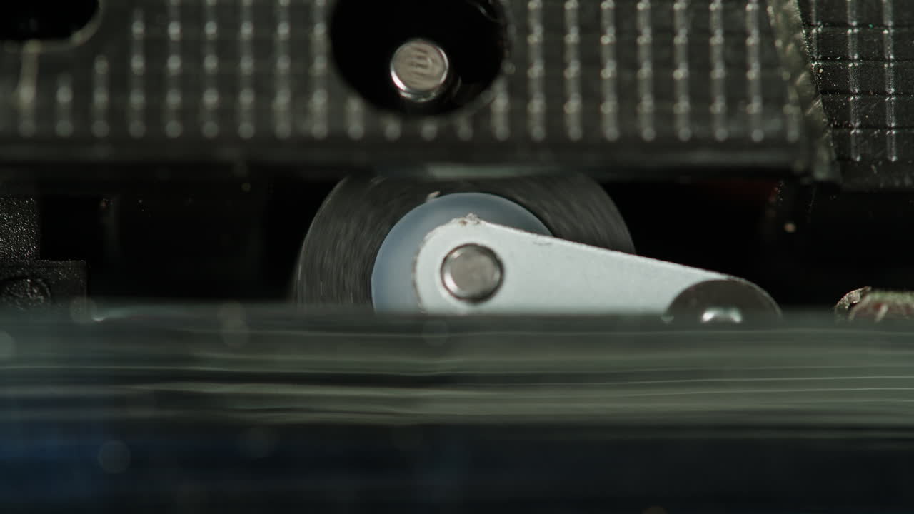 Vintage cassette player on a desk with headphones and tapes creates a nostalgic audio scene, evoking retro vibes