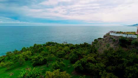 Aerial-panoramic-view-of-the-coastline-of-Nerja,-south-of-Spain,-on-a-cloudy-day