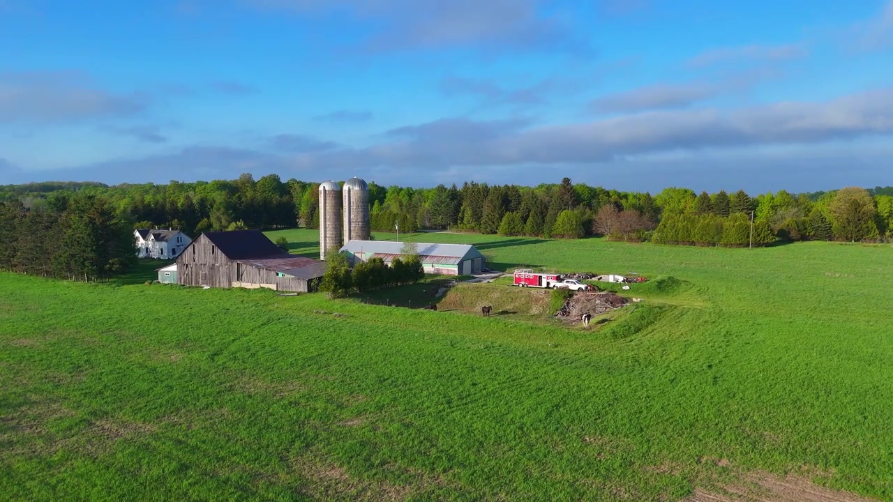 Fog rolling in over a traditional farm in rural Leelanau County, Michigan, America