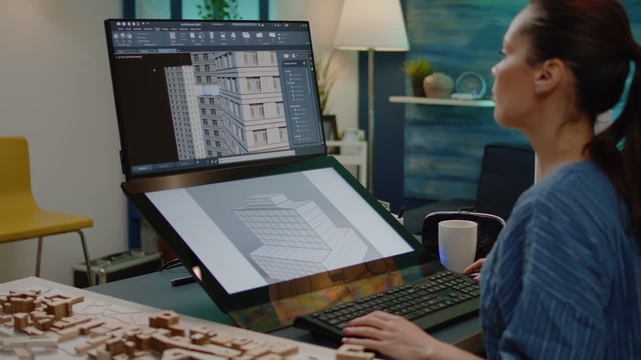 Businesswoman working on building model with touch screen