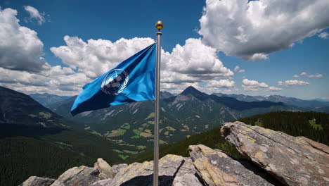 united nations flag on mountain summit