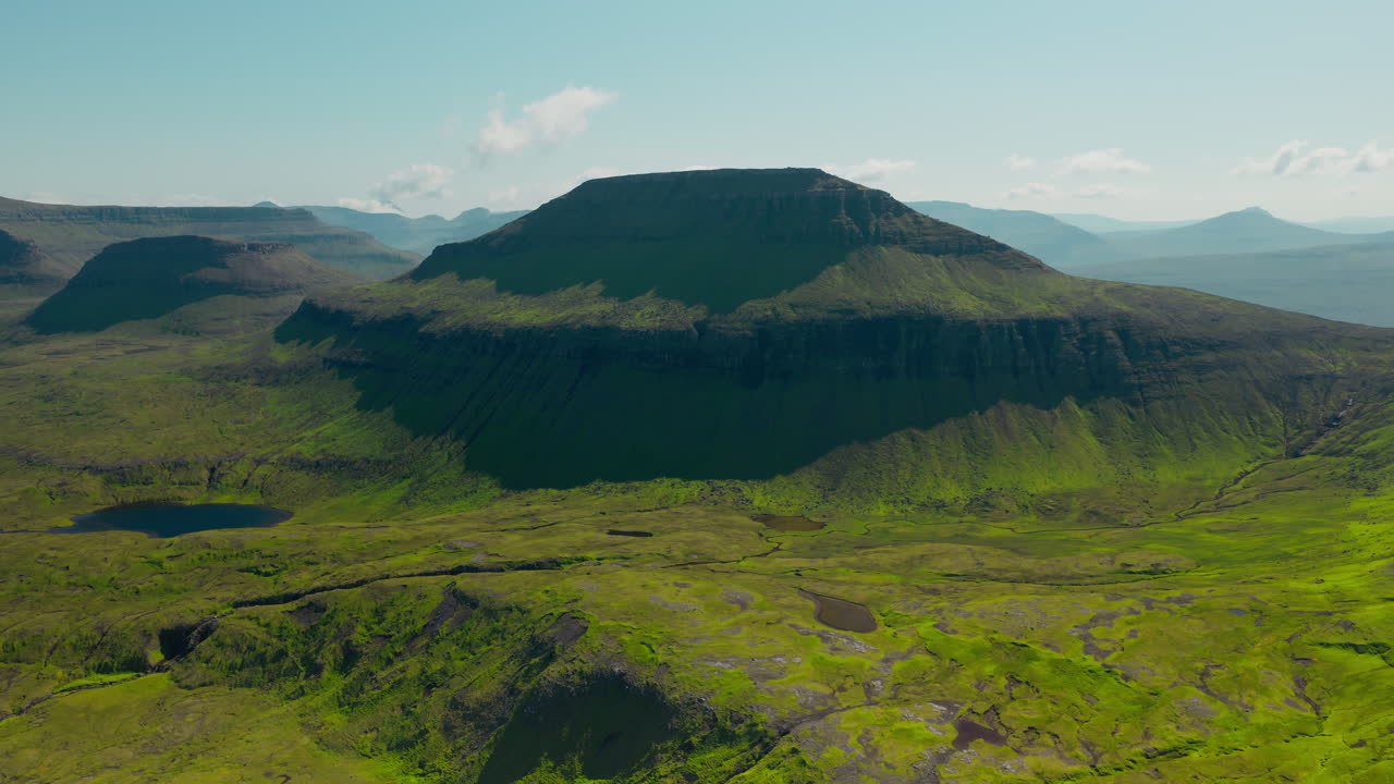 Panoramic View of Green Mountain Landscape with Valleys and Lakes