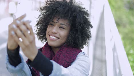 young black woman taking selfie