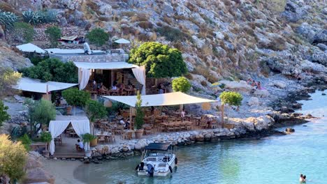 lindos beach overlooking acropolis ruins castle in rhodos, greece, travel destination filmed in 4k during the day