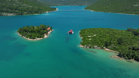 panorama of oyster farm between the island with defenders bridge in ston, croatia. - aerial shot