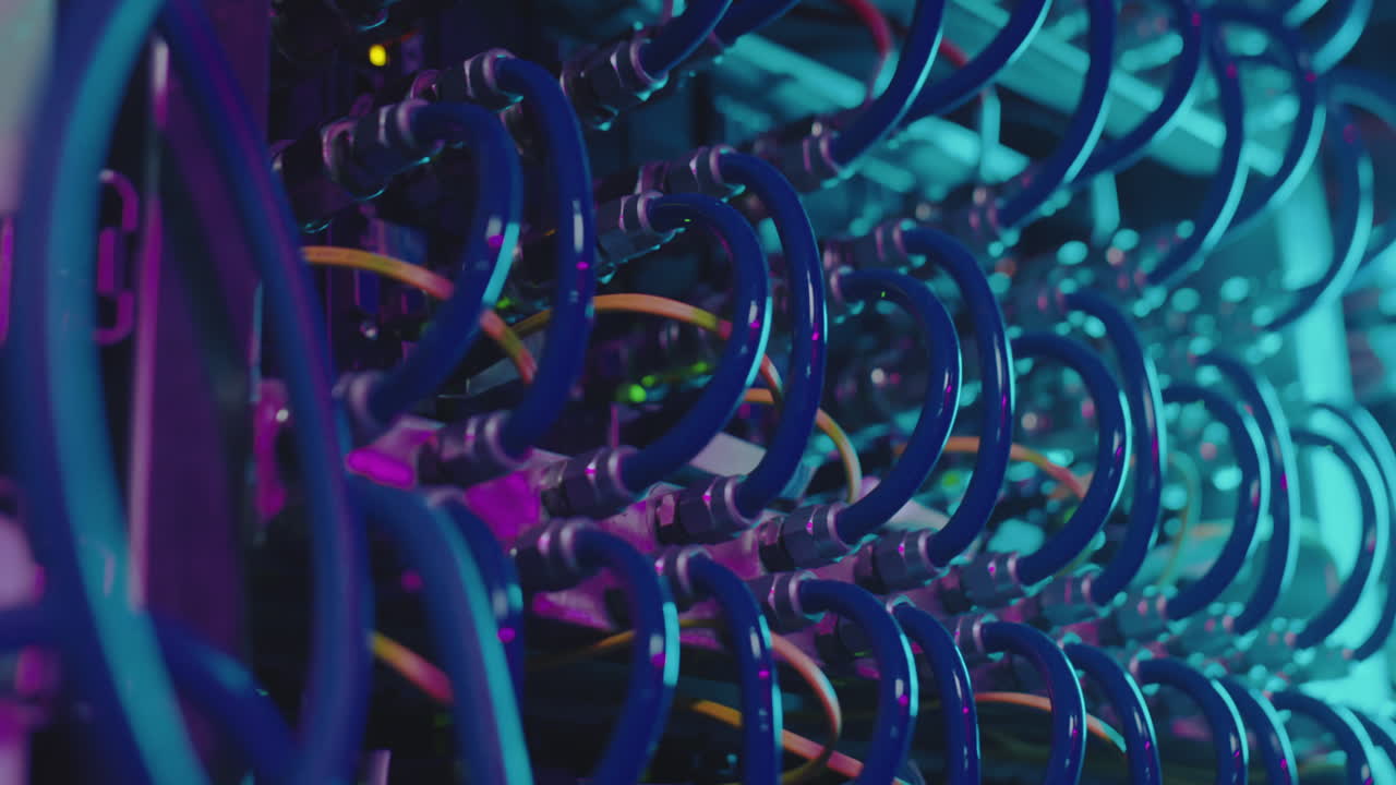Abstract Close-Up of Data Center Server Rack Connections with Neon Lighting