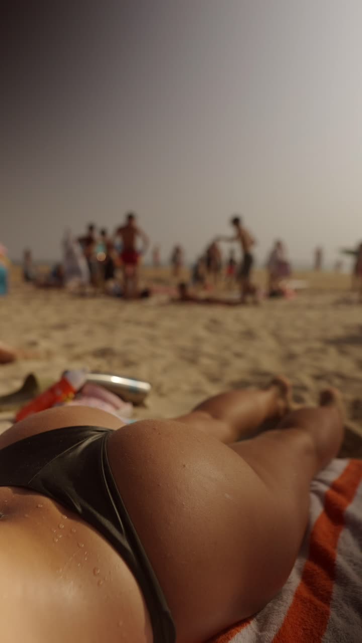 Woman sunbathing on the beach