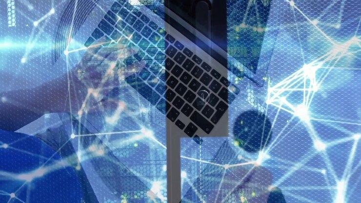 woman typing on laptop and initiating animated network overlay visualizing data flow across desk
