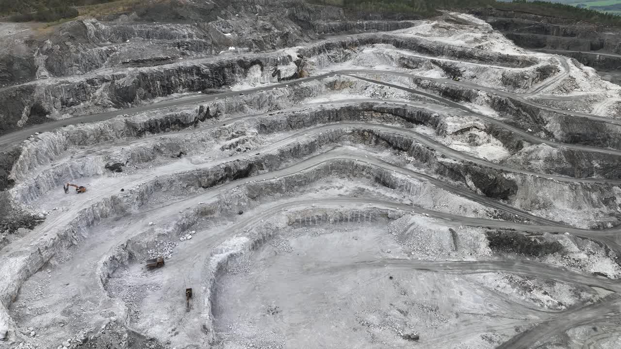 Close view of carved out mountain pattern at mining site between Molde and Kristiansund Norway - Damagaed mountain and nature due to human activities