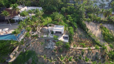 huatulco, mexico beachfront villa with panoramic ocean view and lush greenery - aerial