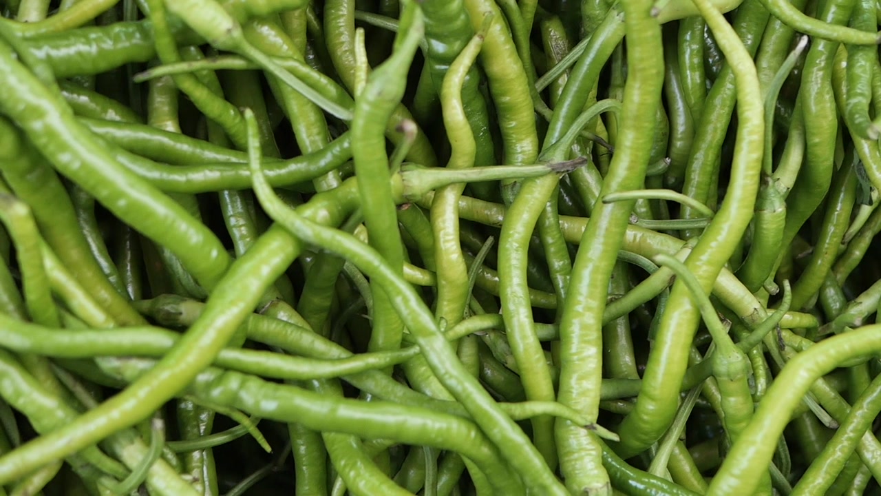 Close-up View of Fresh Green Chili Peppers