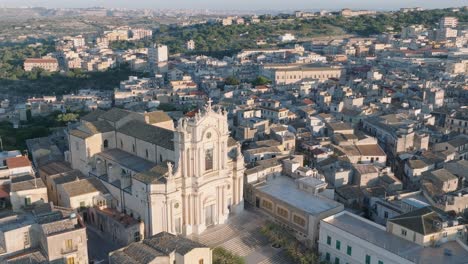 aerial view of modica alta val di noto sicily old baroque town church south italy at sunrise