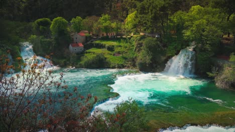 natural majestic waterfall at krka national park in croatia with its exceptional lush green natural beauty in spring time. cinemagraph / seamless video loop of the famous tourist vacation and filming location of the writer karl may western winnetou movies