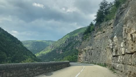 POV-on-the-road-in-Gorges-de-la-Jonte-in-Cevennes,-France,-view-from-front-window-car