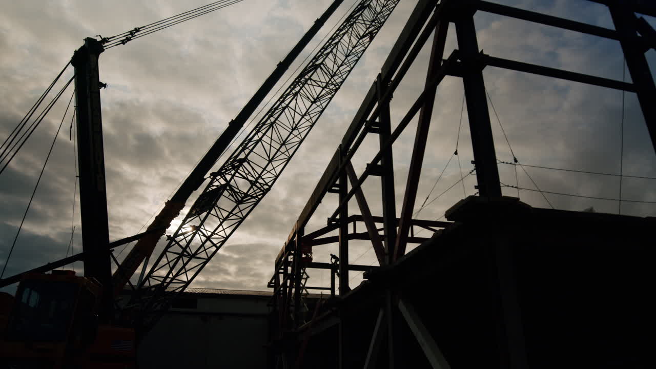 Industrial Construction Site Silhouette with Crane and Steel Structure