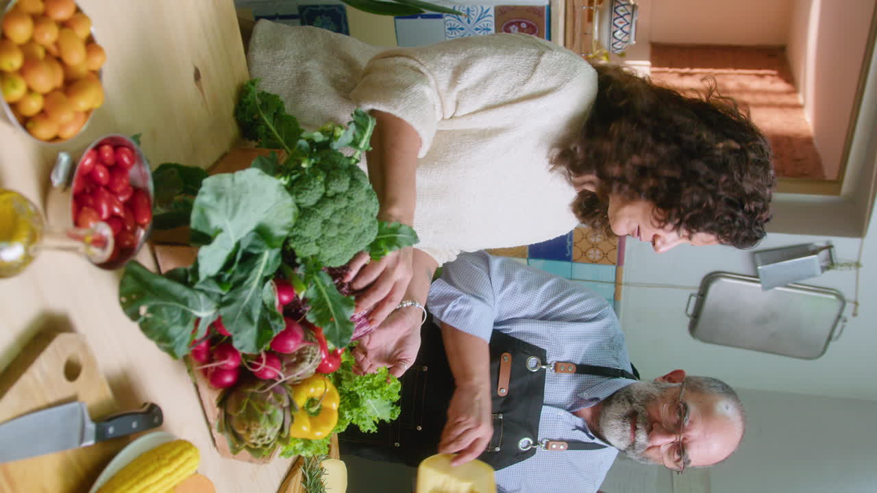 People cooking vegetables in kitchen