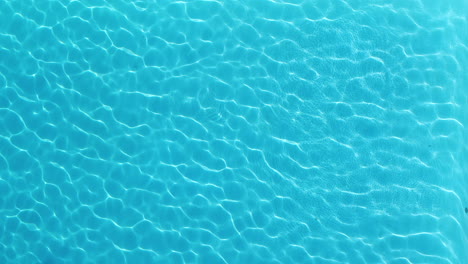 Man-diving-in-a-swimming-pool.-Aerial-view-from-above-beautiful-resort-in-France