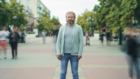 man standing in a city street