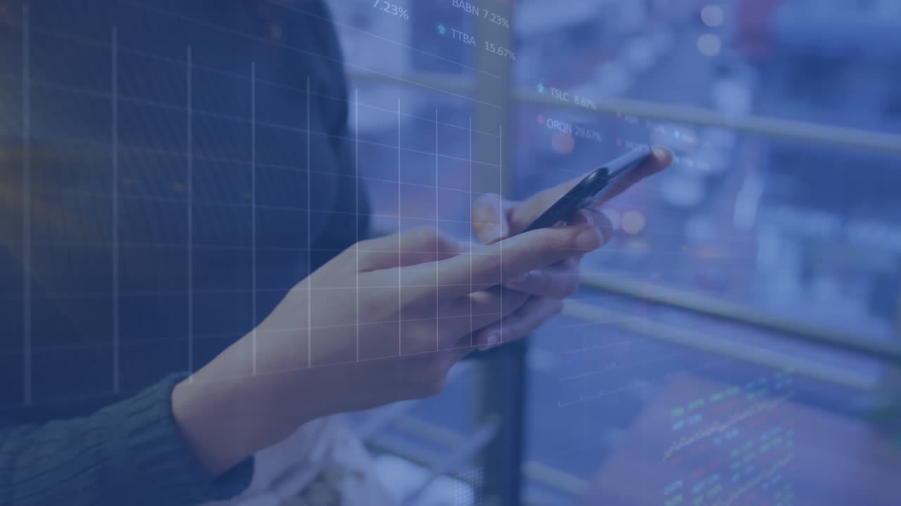 Animation of graphs and trading boards, midsection of caucasian woman scrolling on smartphone
