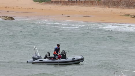 two people rescuing a person from water