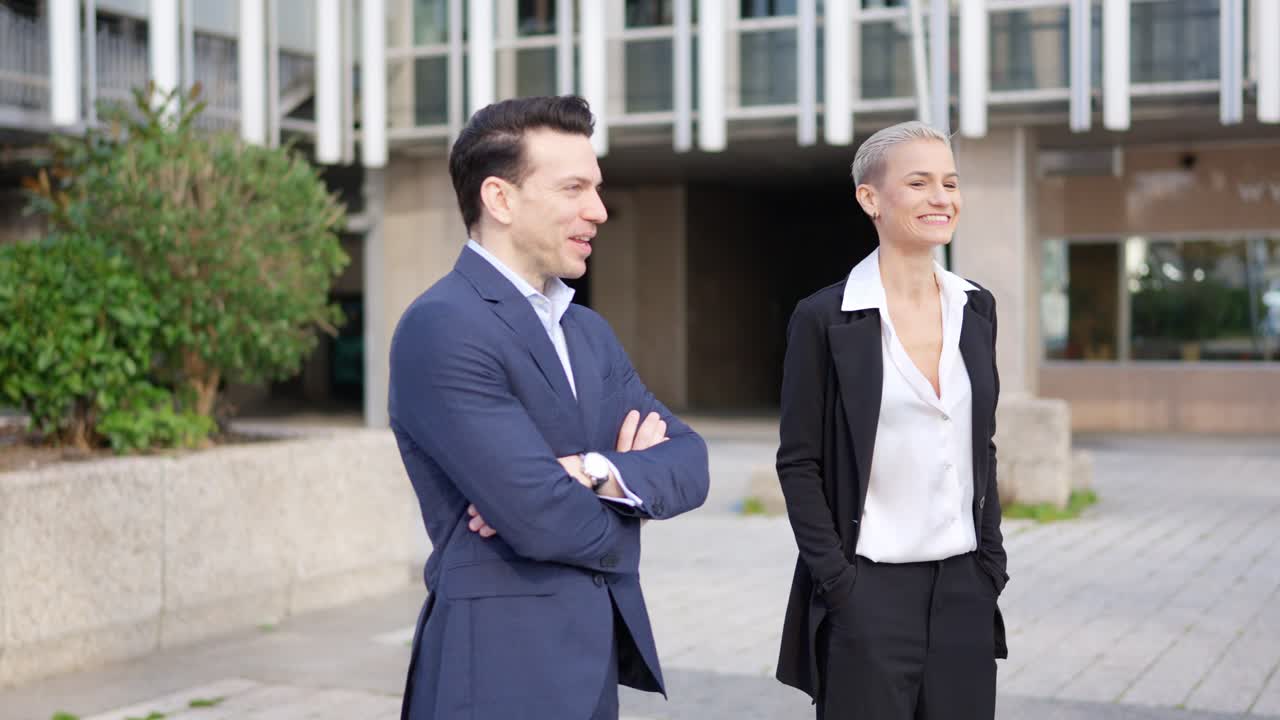 Business Professionals Standing Outdoors in a Modern Urban Setting