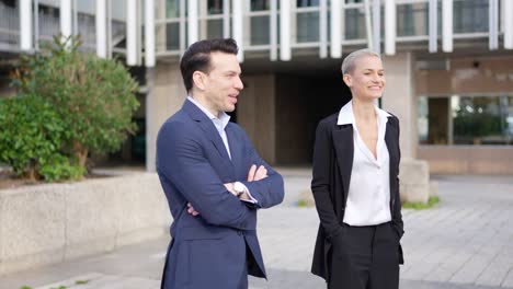 business professionals standing outdoors in a modern urban setting
