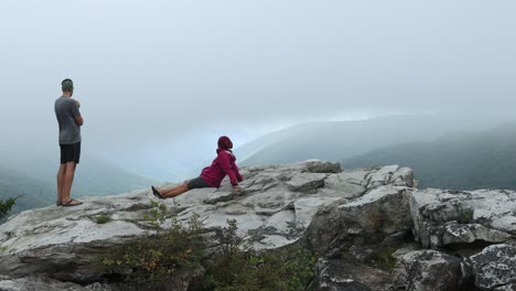 a man and woman at the rohrbaugh cliffs in the dolly sods wilderness, part of the monongahela national forest in west virginia