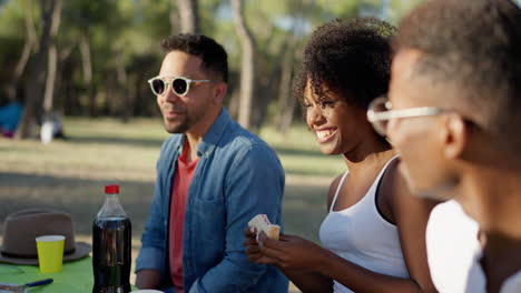 diverse friends enjoying a happy outdoor picnic