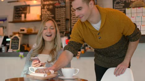 young couple having coffee in cafe 4k