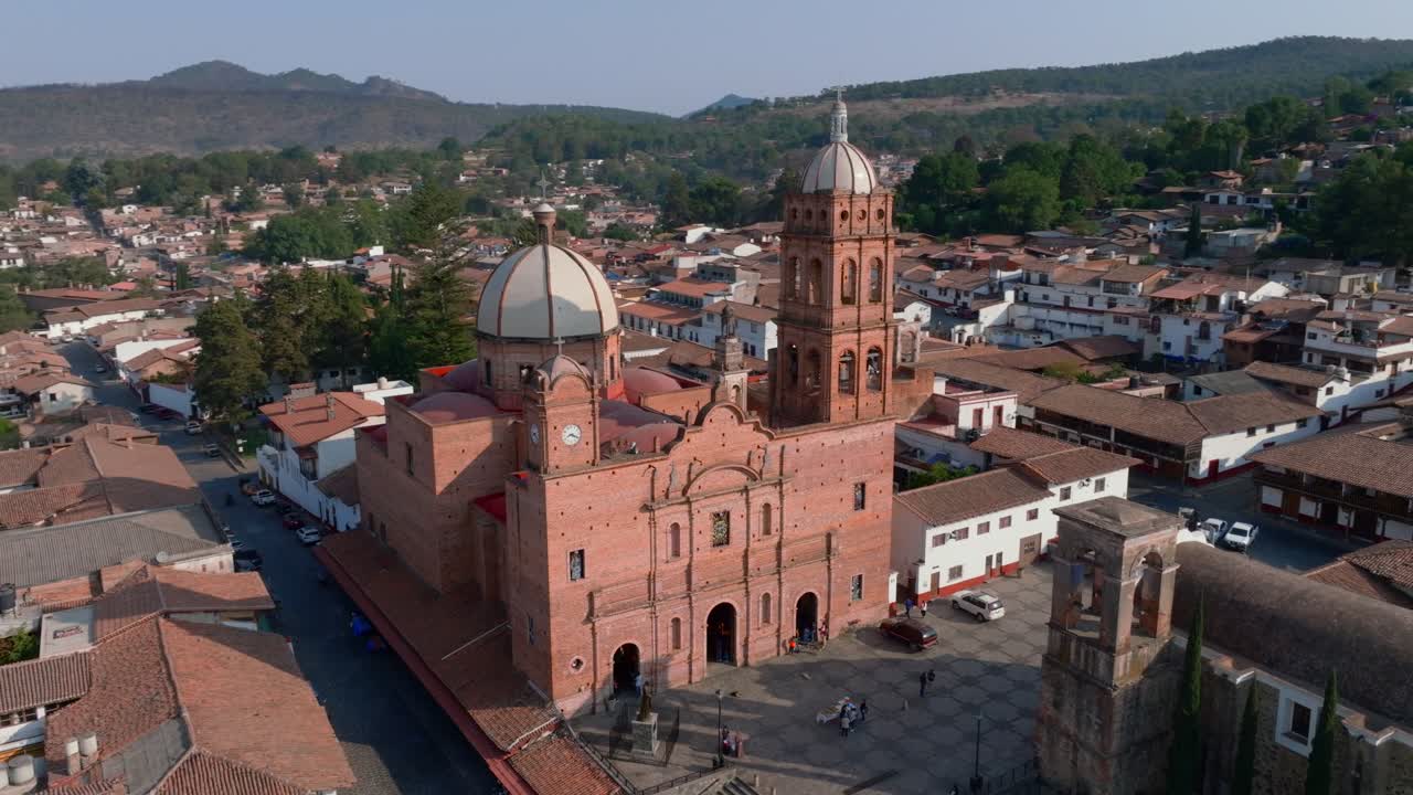 Drone orbit of Our Lady Guadalupe temple and main plaza in Tapalpa, Jalisco, Mexico