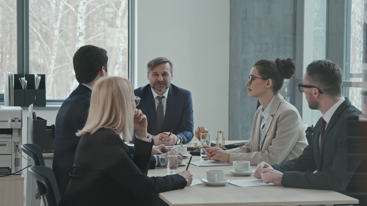 Team of Lawyers Having Meeting in Office