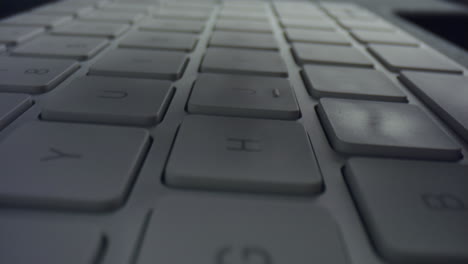 male hands typing on computer keyboard. unrecognizable man using keyboard