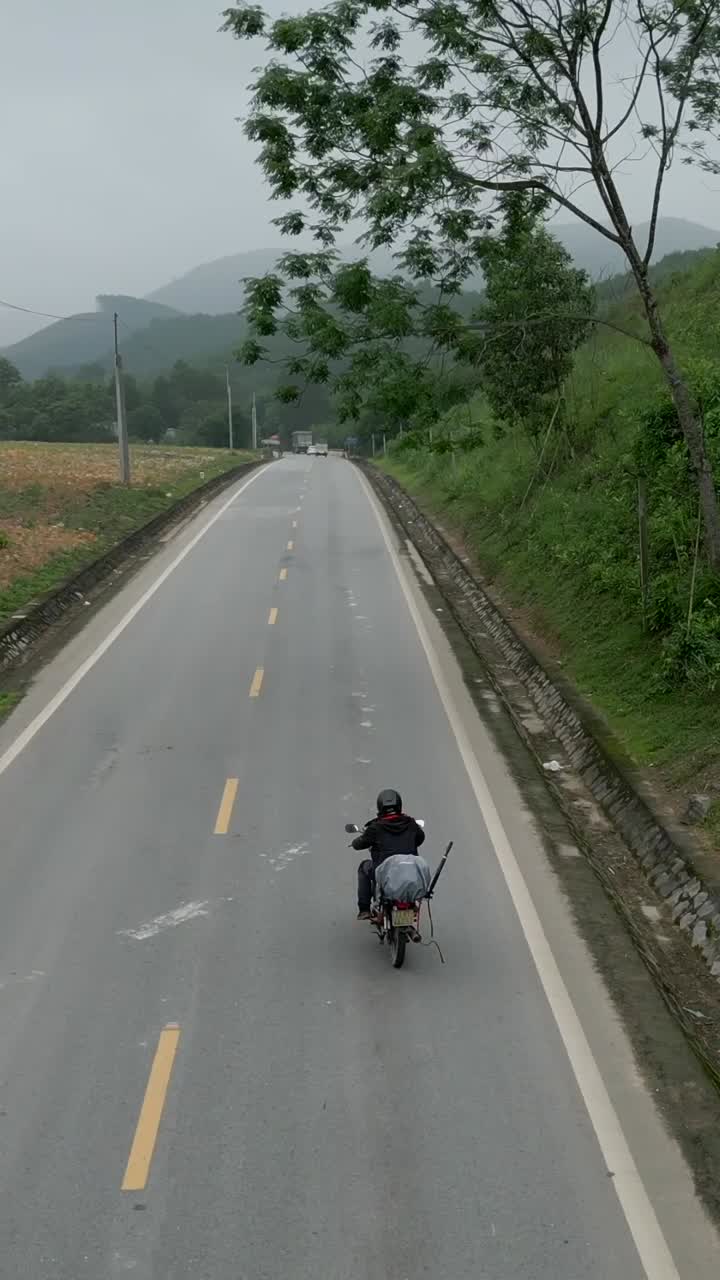 Motorcycle on a Road in a Mountainous Landscape