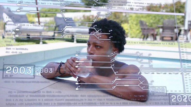 Man holding glass at pool edge scanning and sipping as technology timeline slides, tracking years