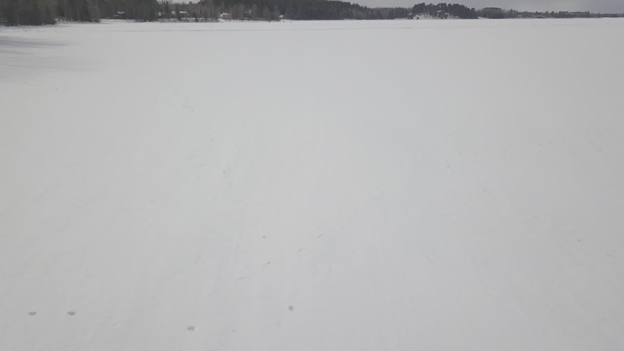 River leading to frozen lake in Ely, St