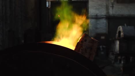 metalwork forge with burning wood