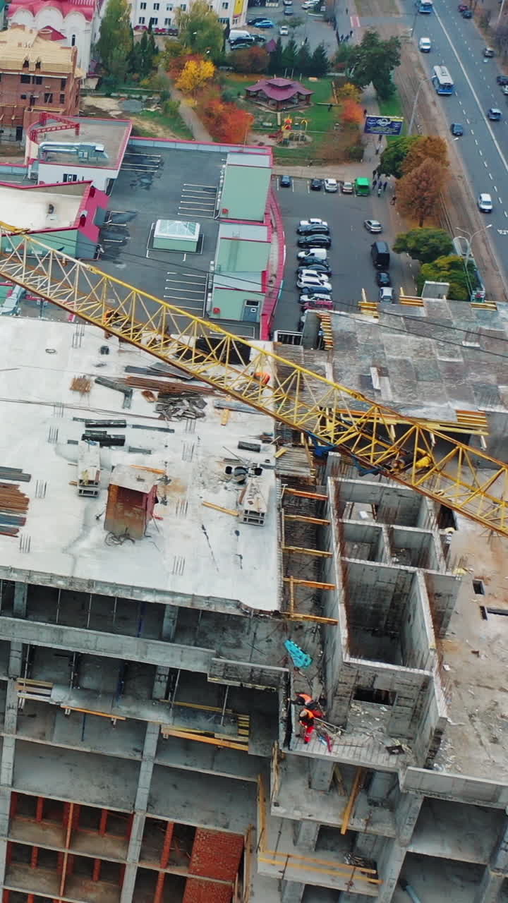 Drone shot of busy construction site. Aerial drone view of construction project in city