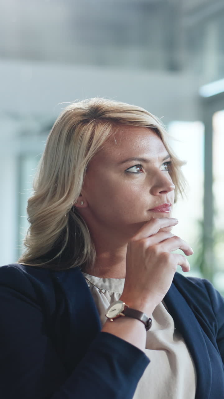 Close-up of a Thoughtful Blonde Businesswoman Contemplating in an Office