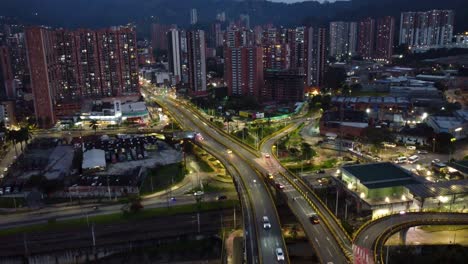 view of the city of medellin at night, light traffic and lights