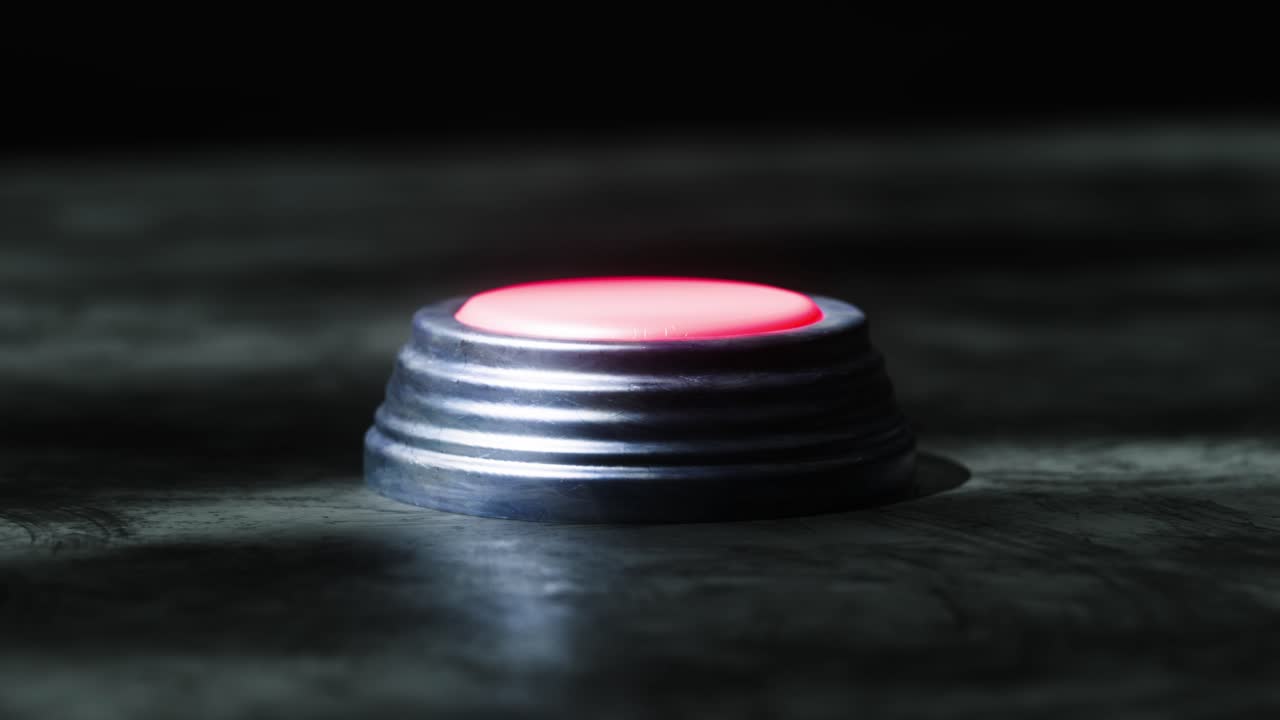 A macro 3D shot of a button being pressed, turning red as it sinks down. The environment feels industrial, grungy, and slightly sci-fi.