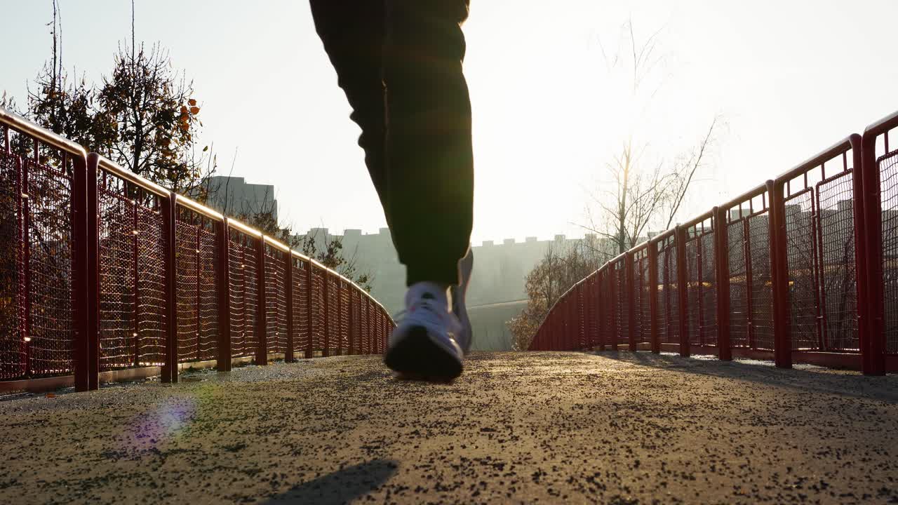 Man Running on a Bridge at Sunrise