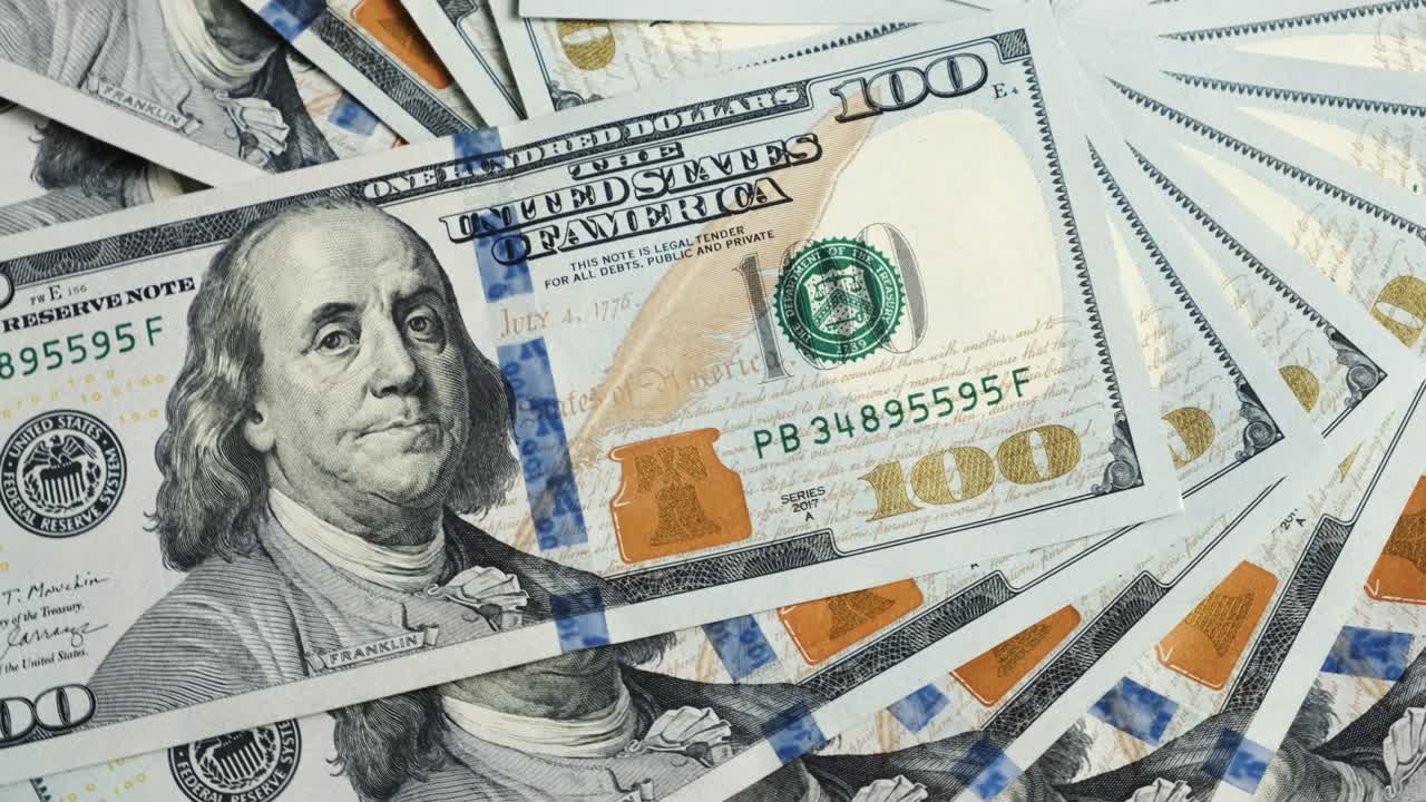 cierre de la moneda billetes de dólar de estados unidos. ingresos y concepto de negocio.